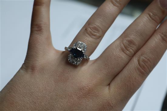 An Art Deco style white metal, sapphire and diamond ring, size M.